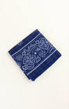 Blue bandana with white patterns on a white background