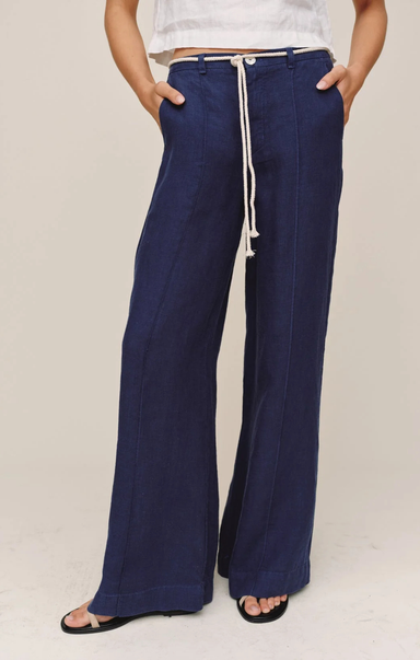 Navy blue wide-leg pants with a drawstring waist on a plain background