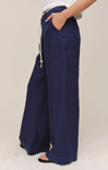 Navy wide-leg pants worn by a person on a plain background