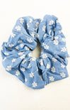 Blue floral scrunchie on a white background