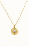 Gold necklace with a star pendant on a white background