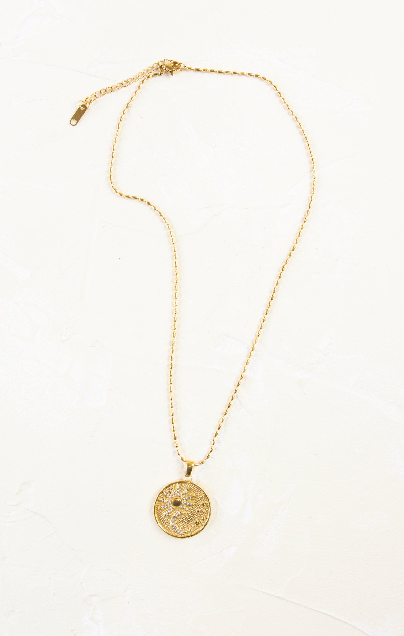 gold pendant necklace with constellation pendant