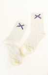 Pair of white socks with blue X designs on a white background