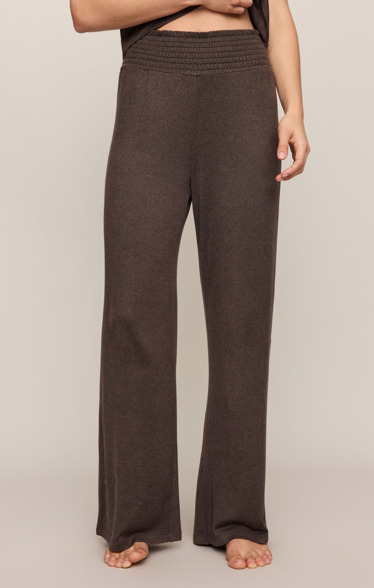 Brown wide-leg pants worn by a person on a plain background