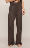 Brown wide-leg pants worn by a person on a plain background