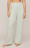 Light green ribbed pants worn by a person on a plain background