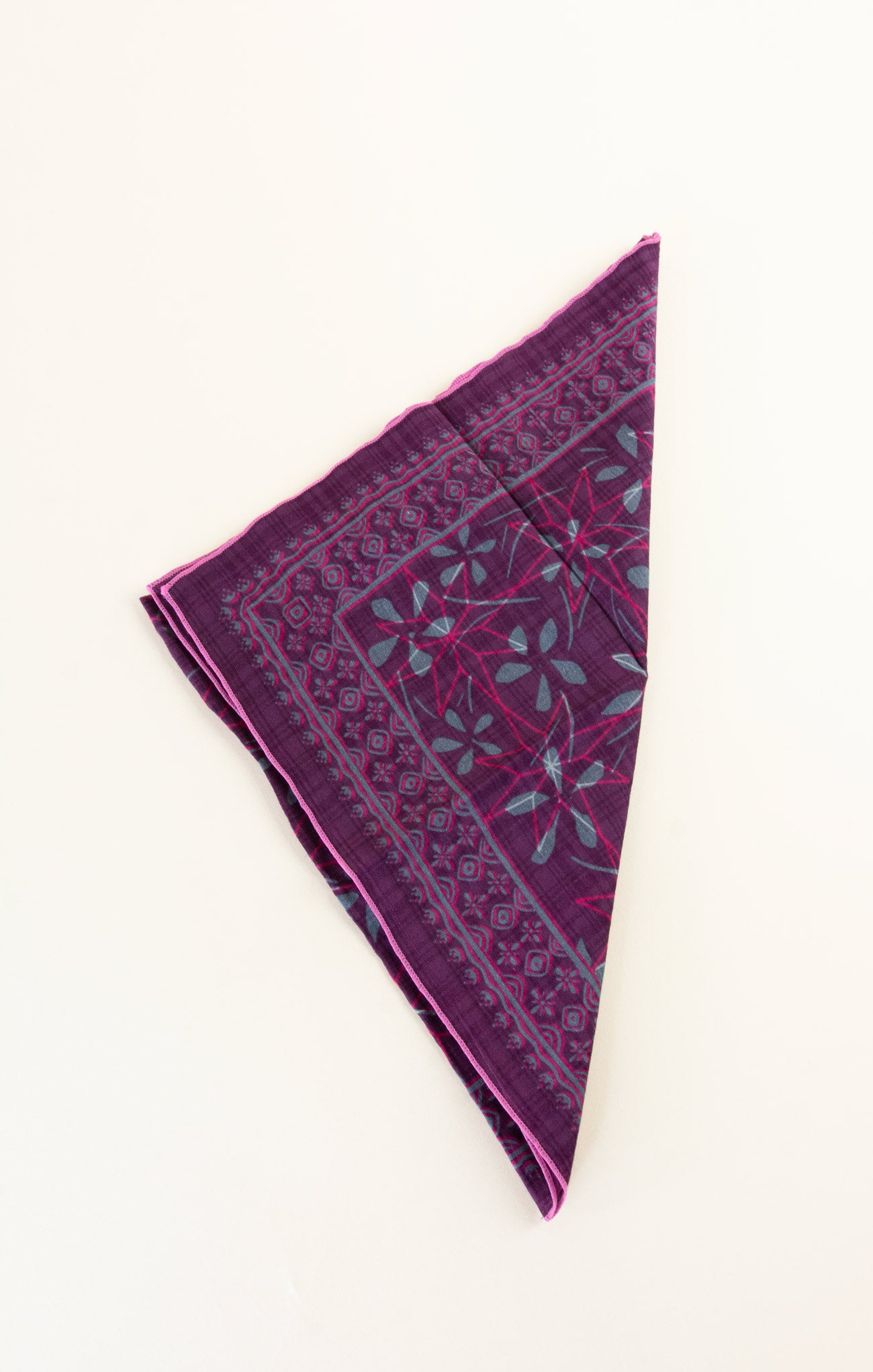 Purple patterned fabric on a white background