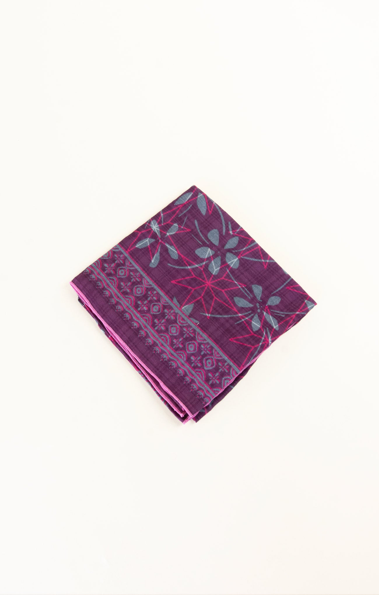 Purple patterned fabric on a white background