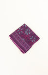 Purple patterned fabric on a white background