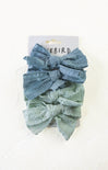 Two denim-colored lace headbands on a white background with 'Bluebird' branding.
