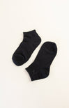 Pair of black ankle socks on a white background