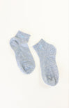 Pair of light blue socks on a white background