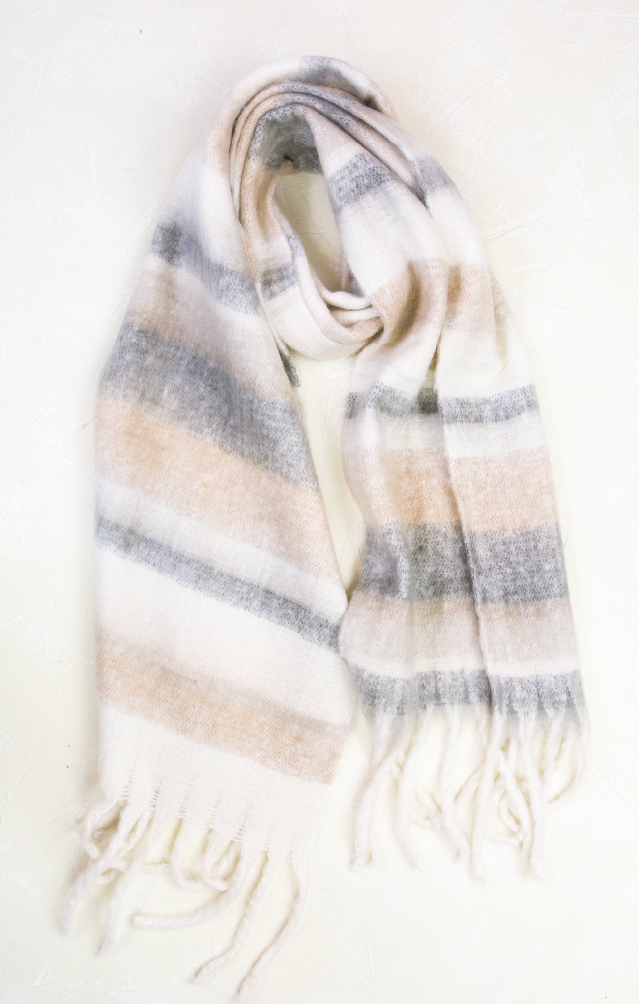 Striped scarf with fringes on a white background
