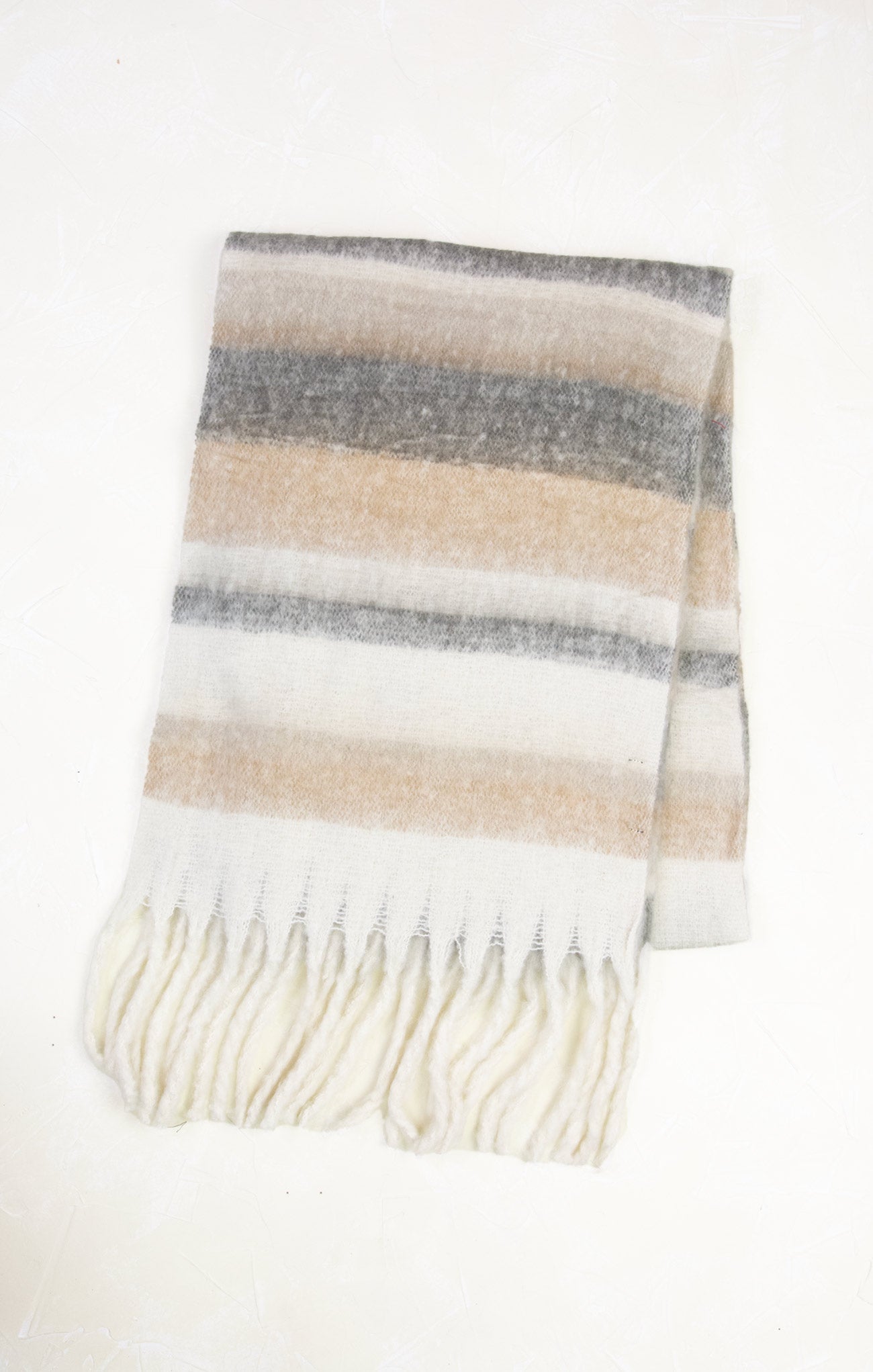 Striped scarf with fringes on a white background