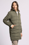 Woman wearing a green puffer coat on a white background