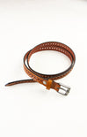Brown leather belt with perforated design on a white background