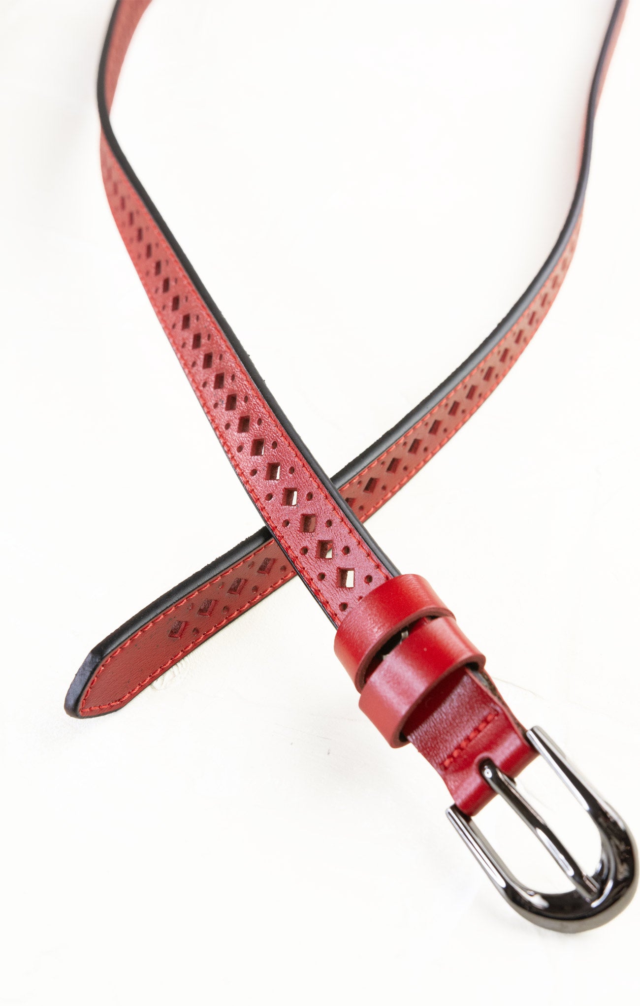 Red leather belt with a silver buckle on a white background