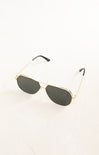 Gold-framed sunglasses with dark lenses on a white background
