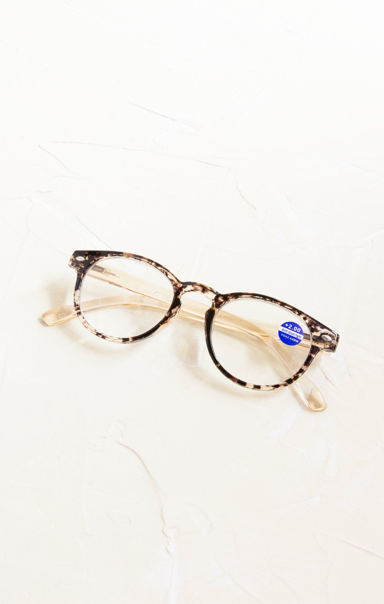 Tortoiseshell cat-eye glasses on a white background