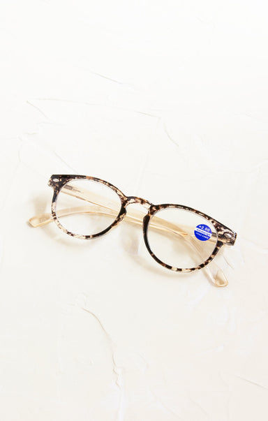 Tortoiseshell cat-eye glasses on a white background