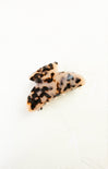 Leopard print hair clip on a white background