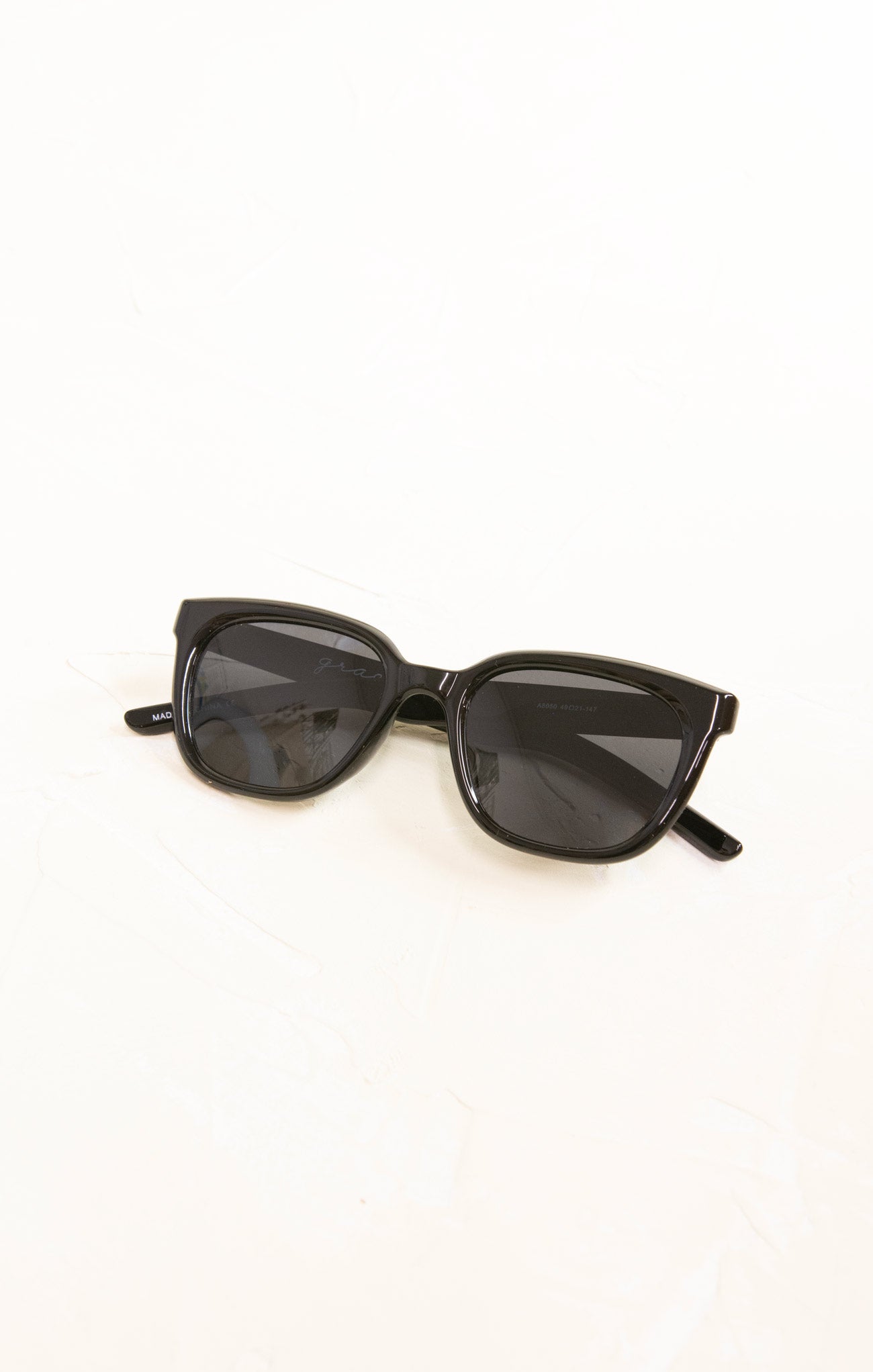Black sunglasses on a white background