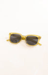 Gold-framed sunglasses with dark lenses on a white background