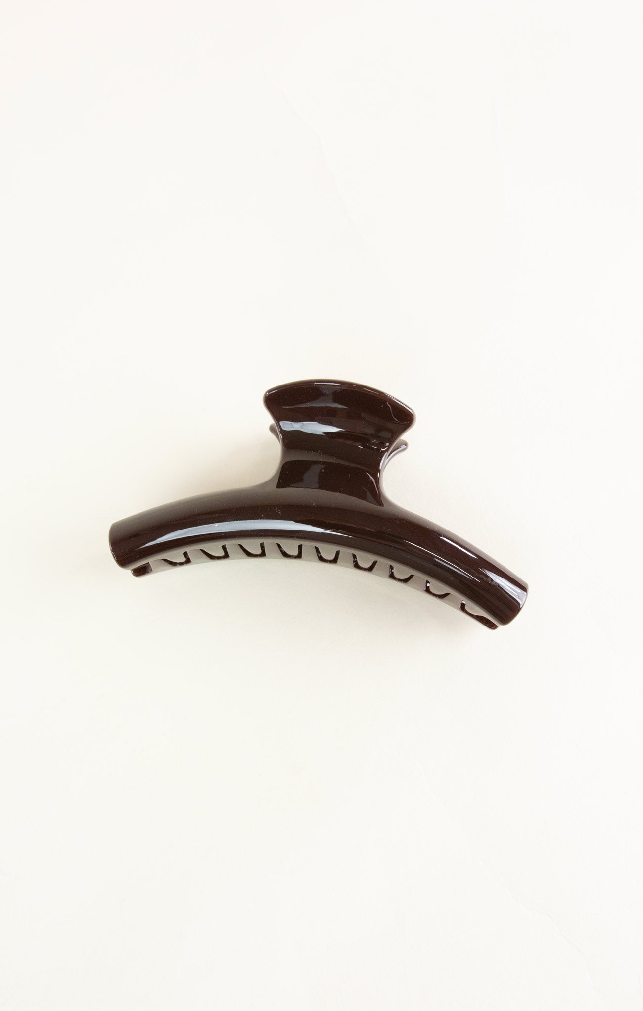 Brown hair clip on a white background