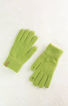 Pair of green gloves on a light background