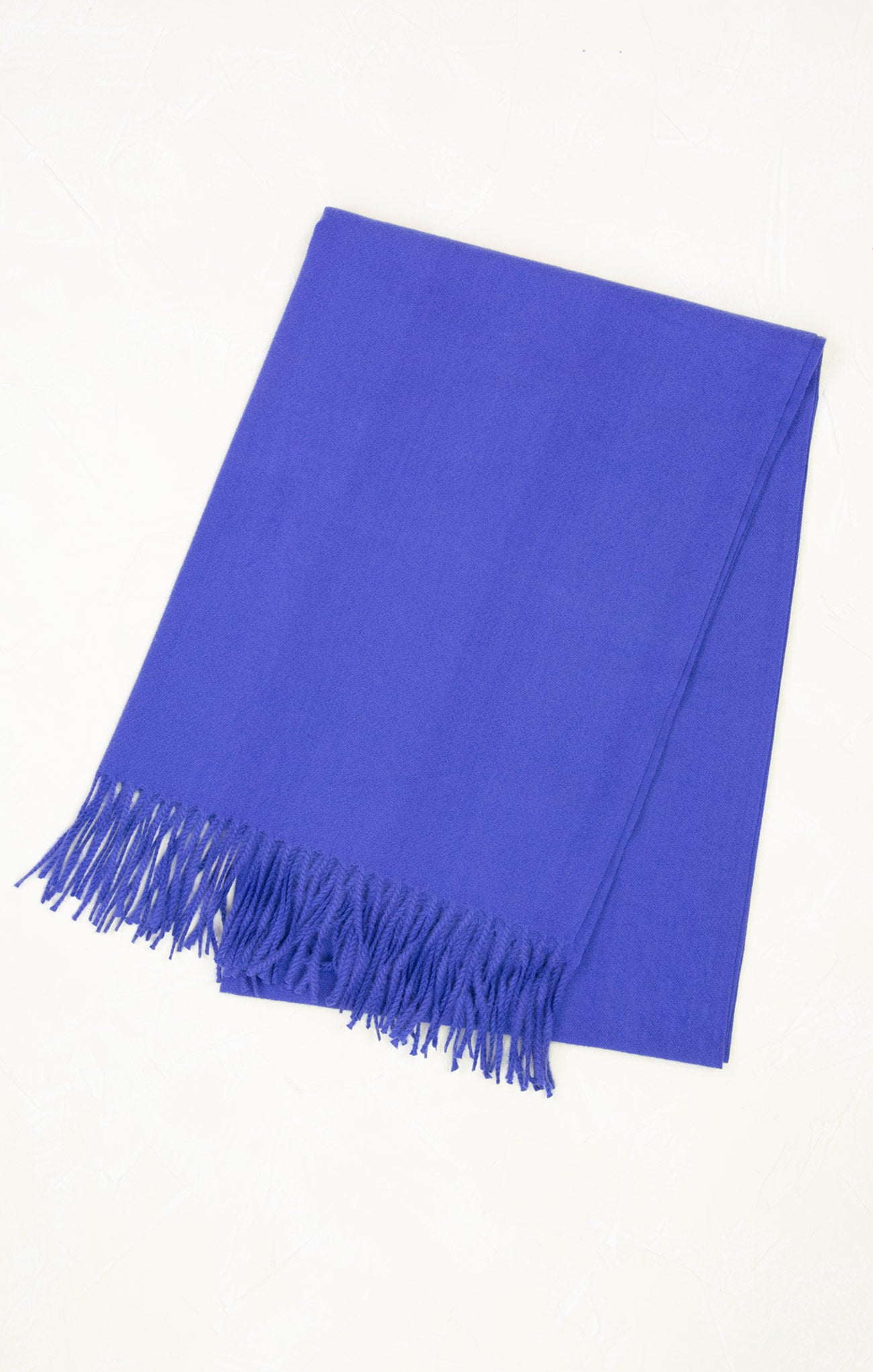 Blue scarf with fringes on a white background