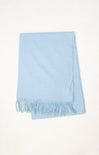 Light blue scarf with fringes on a white background