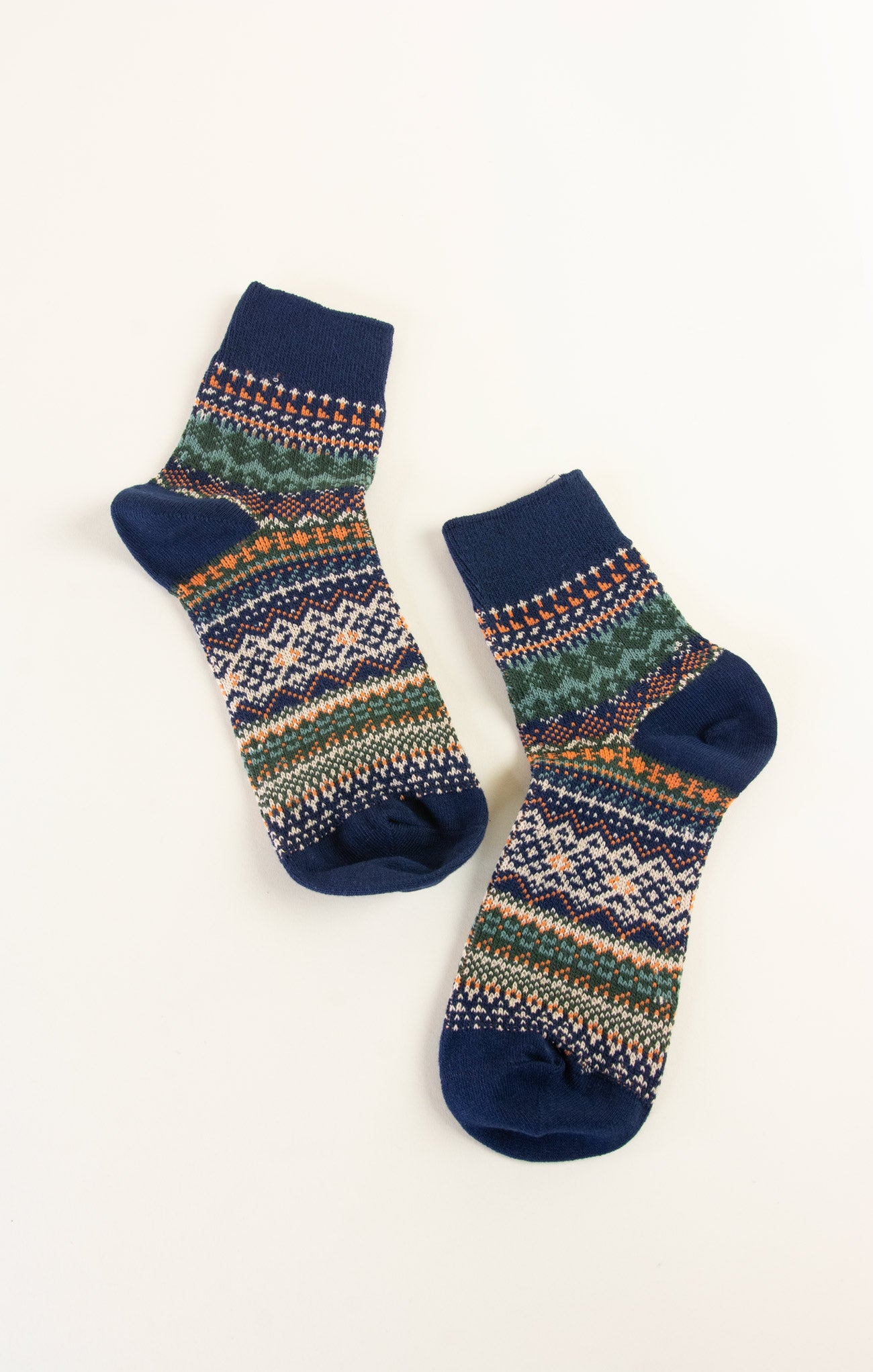 Pair of patterned socks with blue accents on a white background
