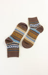 Pair of brown socks with a pattern on a white background