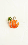 Pumpkin-shaped earring with rhinestone details on a white background