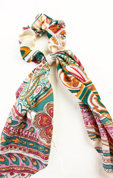 Colorful patterned hair scrunchie on a white background