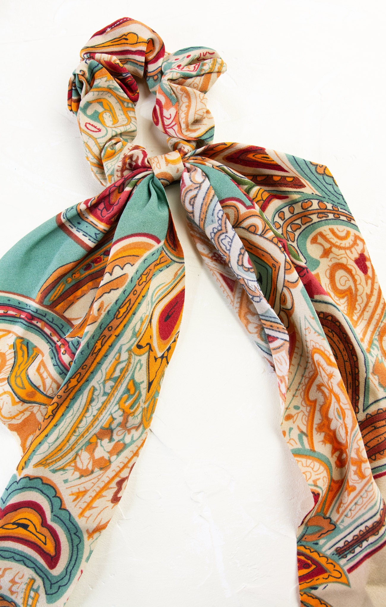 Colorful patterned hair tie on a white background