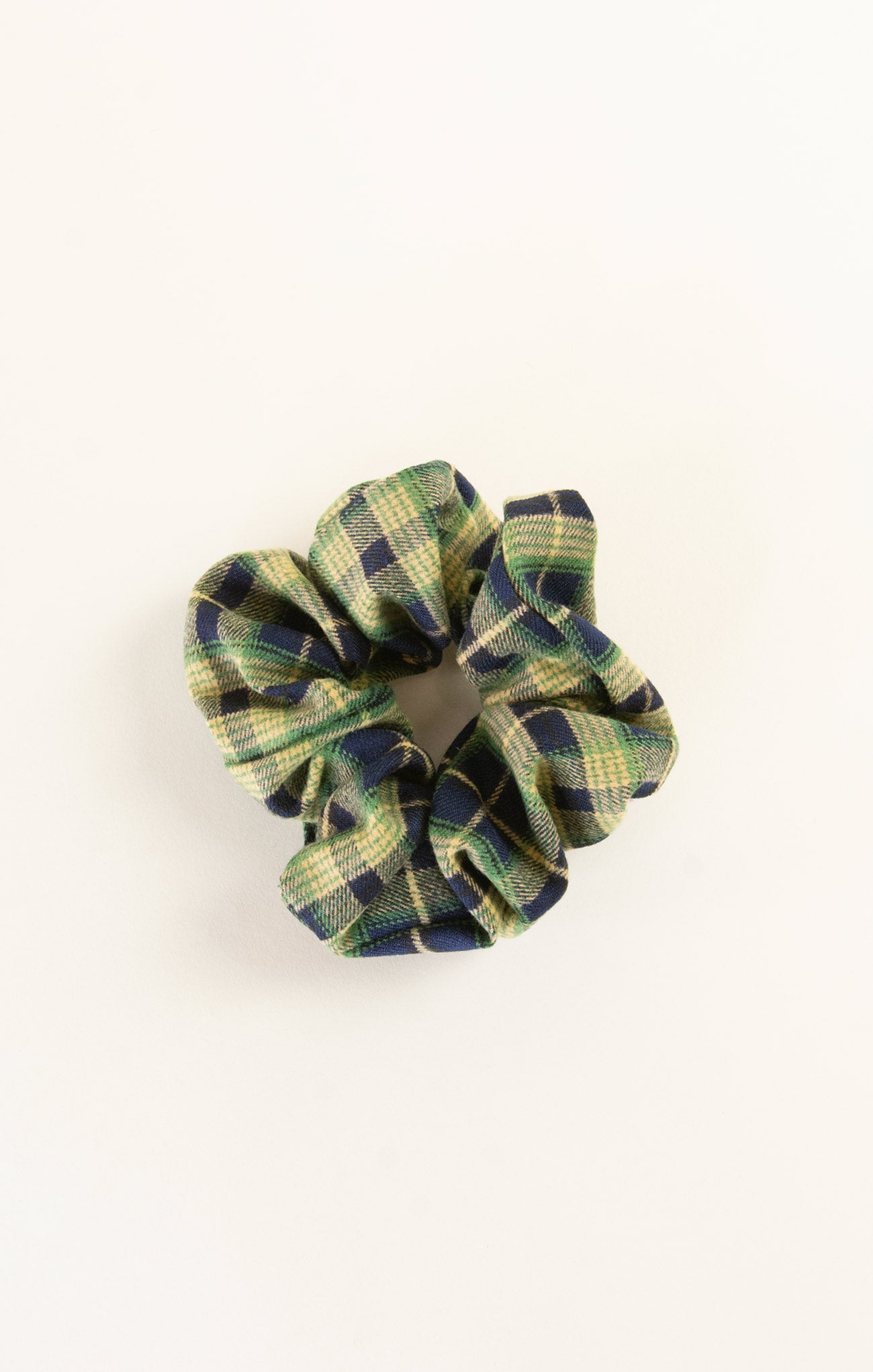 Plaid patterned scrunchie on a white background
