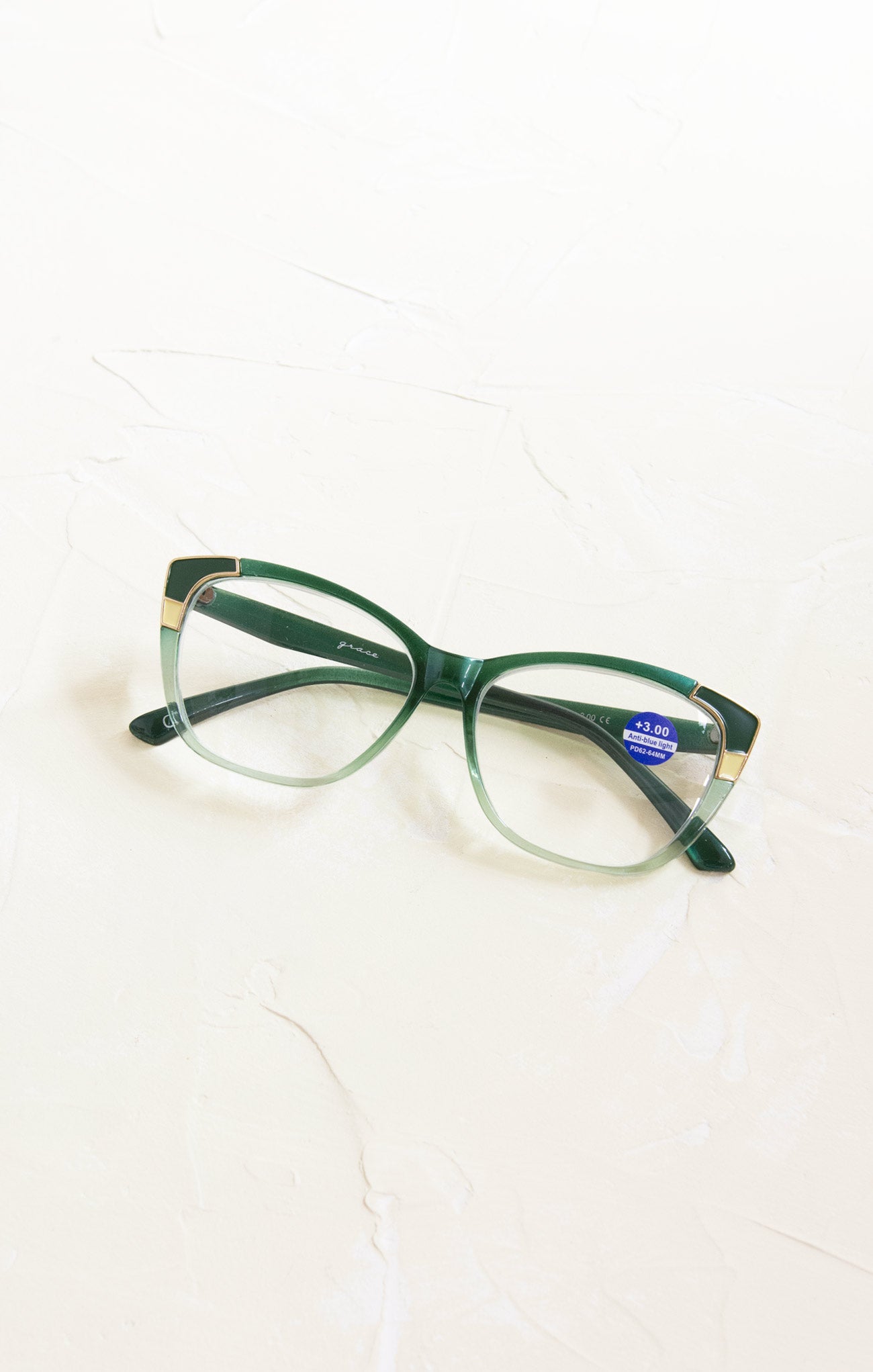Green eyeglasses on a white background