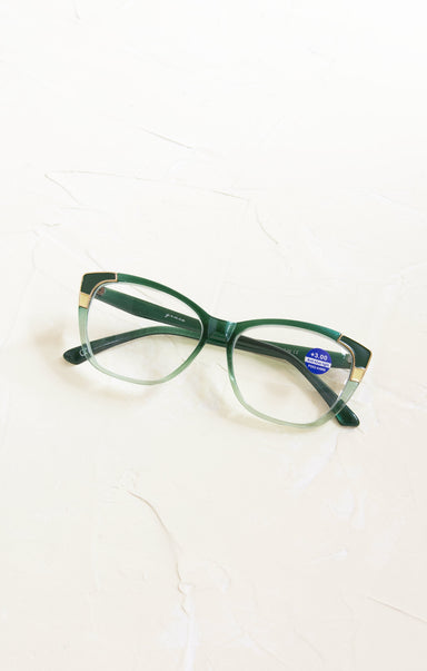 Green eyeglasses on a white background