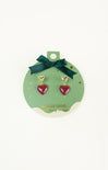 Heart-shaped earrings on a green card with gold accents