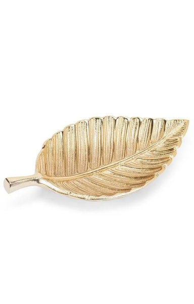 A gold-toned metal leaf-shaped dish with a textured, ribbed surface and a short stem, photographed on a clean white background.