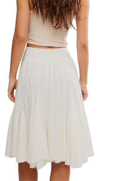 White skirt worn by a person on a white background