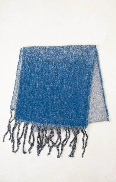 Blue and gray plaid blanket with fringes on a white background