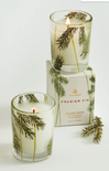 Two candles with pine tree design and packaging labeled 'Frasier Fir' on a white background.