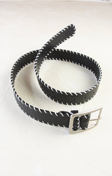 Black leather belt with white stitching on a white background