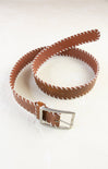 Brown leather belt with a silver buckle on a white background