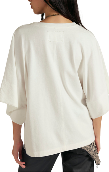 White blouse worn by a person on a white background