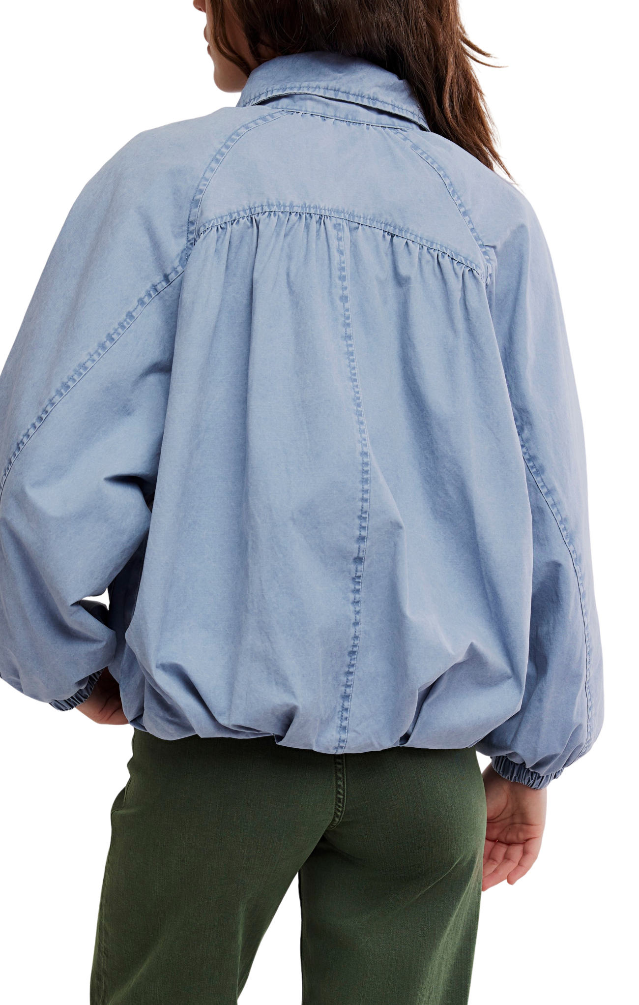Light blue denim jacket worn by a person on a white background