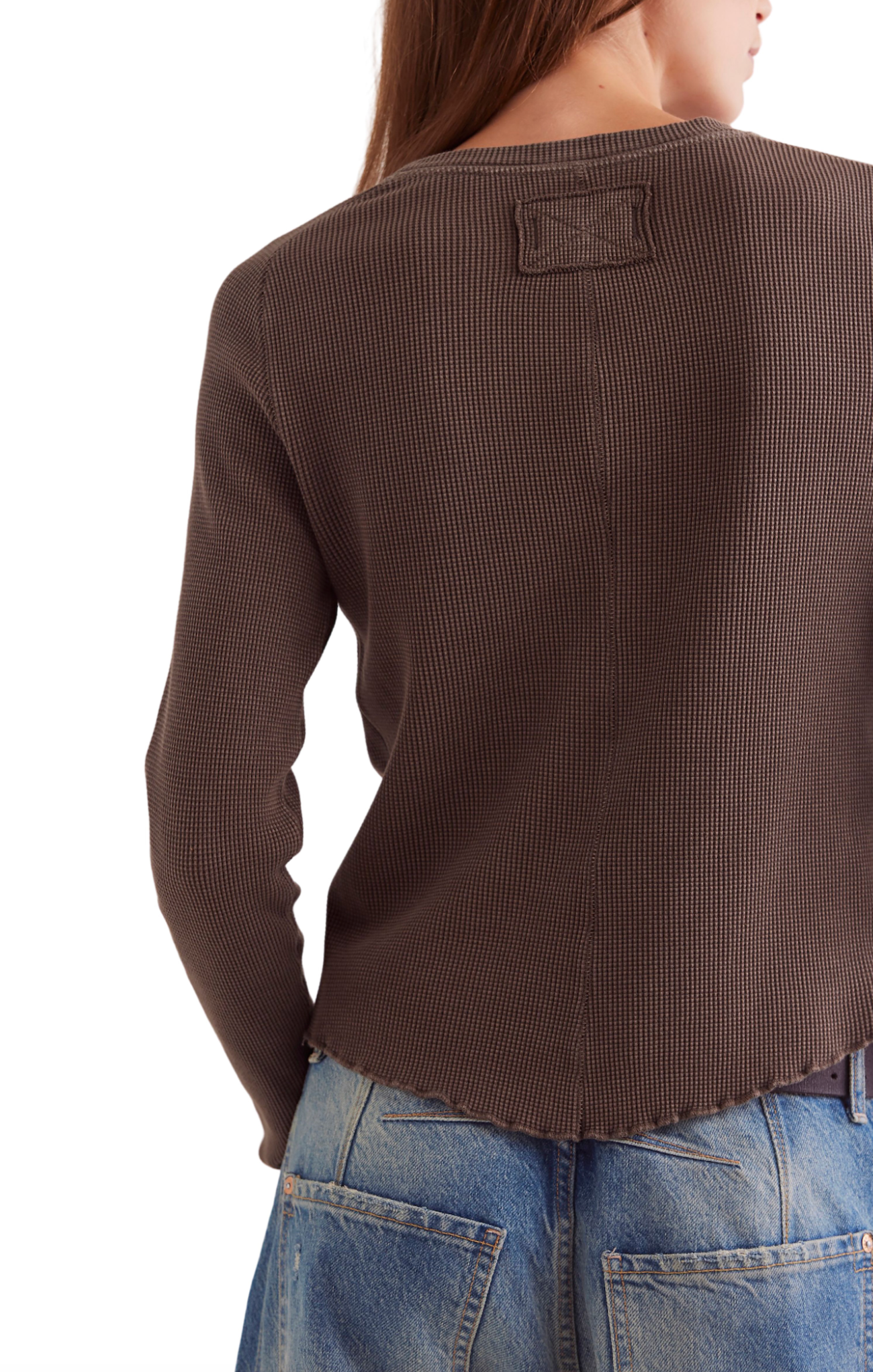 Brown textured sweater worn by a person on a white background