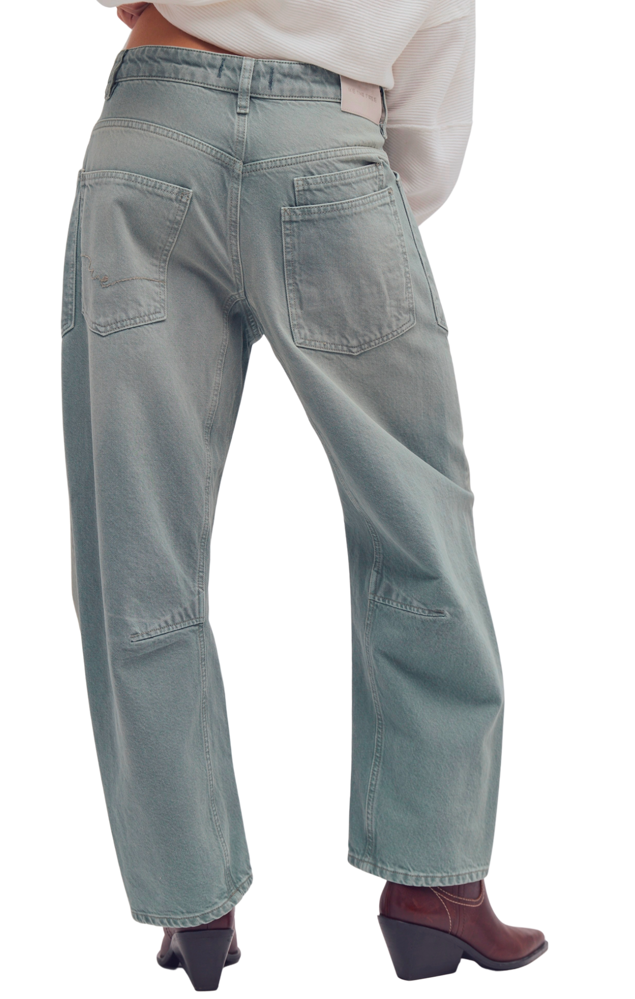 Light blue jeans worn by a person on a white background